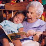 foster grandmother reading to girl
